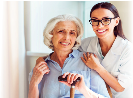 caregiver and elderly woman smiling