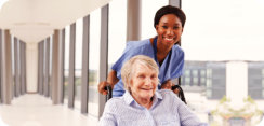 nurse and elderly woman smiling