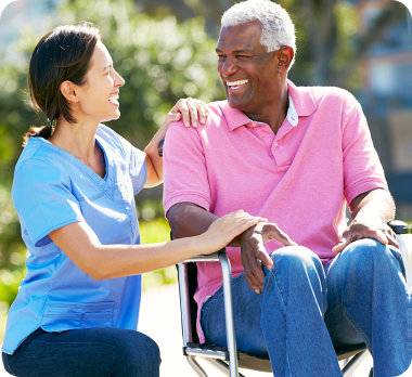 nurse and elderly man talking