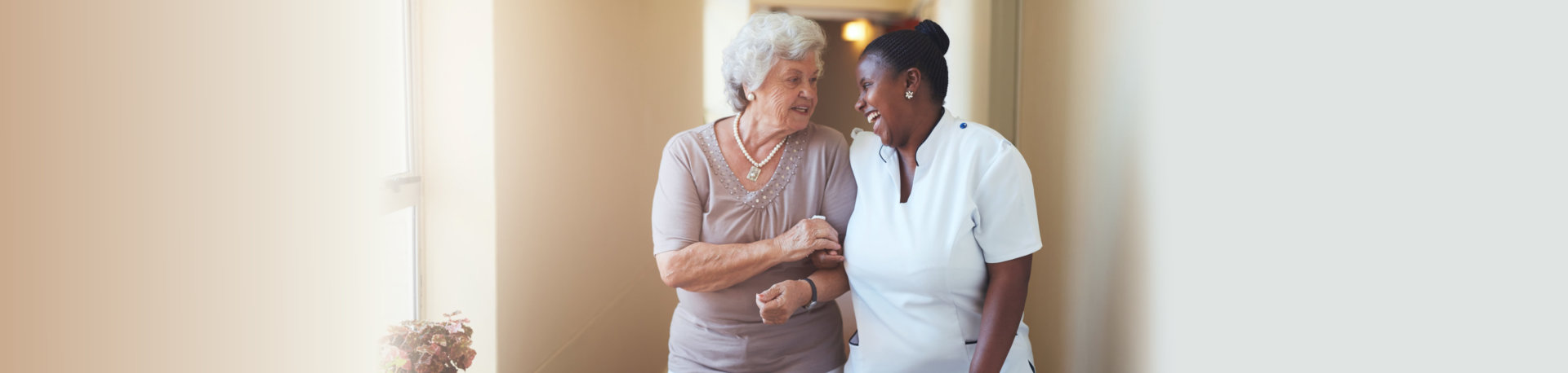 nurse and elderly woman talking