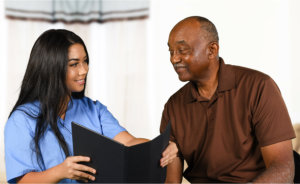 caregiver talking to elderly senior